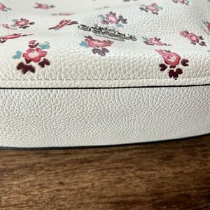 Coach floral shoulder bag.  In good shape, a few marks on outside.